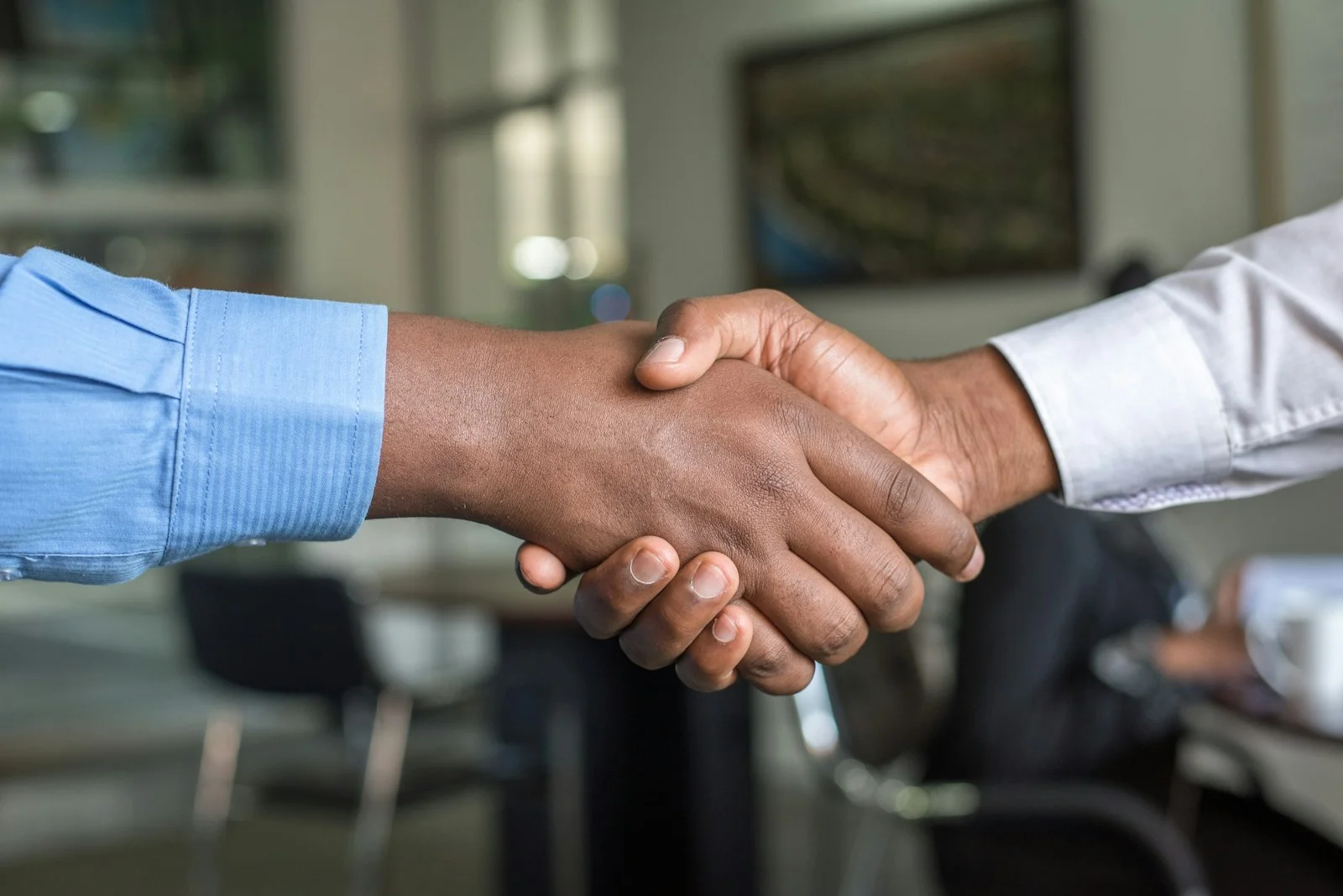 Business handshake — partnership and trust with Alpha Softwares
